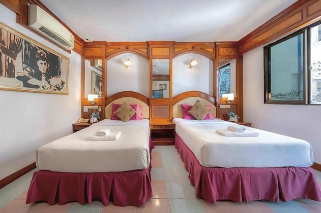 Кровать в номере Deluxe Twin в Lamai Hotel